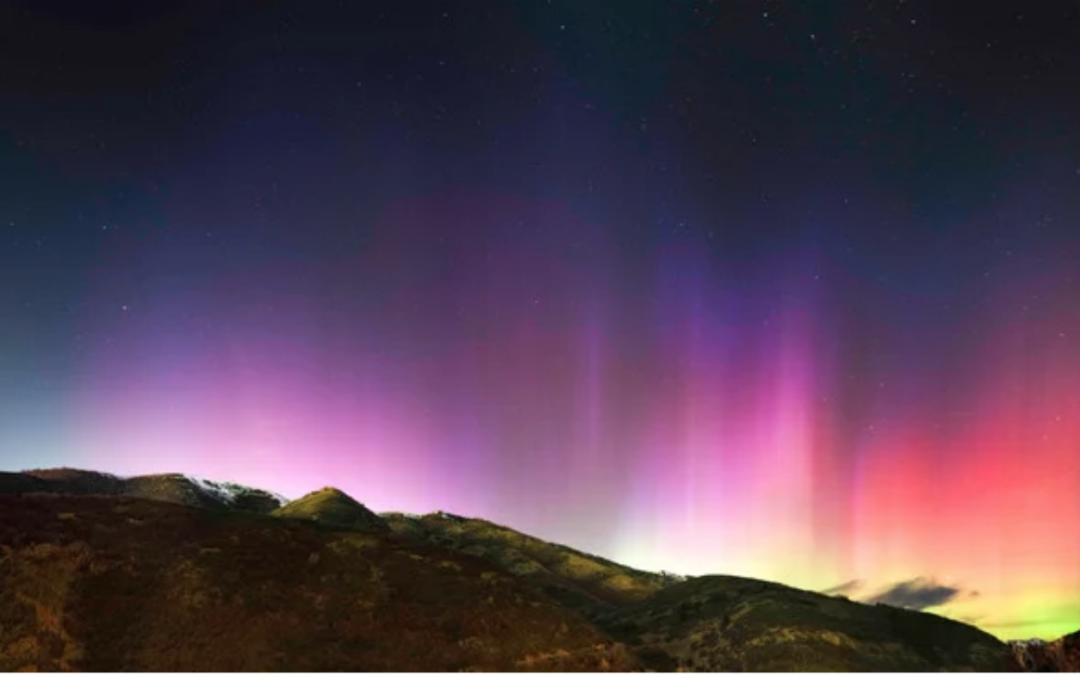 Photo: The Aurora Borealis over the foothills of the Wasatch Front in Emigration Canyon, Utah. The aurora was so bright that the gibbous moon and moon-conjunction with Venus did not dull its colors!